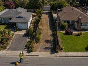 Property line survey for a shared access drive between two neighboring residential lots 