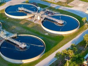 As-built survey of a completed water treatment expansion in Madison, Alabama, showing tanks, piping, utilities, access roads, and finished elevations.